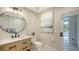 Modern powder room featuring a vessel sink, and direct access to the outdoor pool at 6641 Saint James Xing, University Park, FL 34201