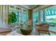 Relaxing sitting area with comfortable seating and views of the beautiful outdoor landscape at 6641 Saint James Xing, University Park, FL 34201