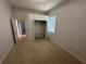 Bright, carpeted bedroom with closet at 6839 Turnberry Isle Ct, Lakewood Ranch, FL 34202