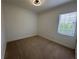 This bedroom has neutral walls, carpet and great natural light at 6839 Turnberry Isle Ct, Lakewood Ranch, FL 34202
