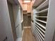 Walk-in closet with custom shelving provides ample storage space at 6839 Turnberry Isle Ct, Lakewood Ranch, FL 34202