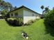 Well-maintained home exterior with lush landscaping and a green lawn at 6839 Turnberry Isle Ct, Lakewood Ranch, FL 34202