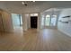 Open foyer featuring wood flooring, arched doorways and windows, and a decorative chandelier at 6839 Turnberry Isle Ct, Lakewood Ranch, FL 34202