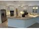 Well-lit kitchen features stainless steel appliances, granite counter tops, and lots of cabinet space at 6839 Turnberry Isle Ct, Lakewood Ranch, FL 34202