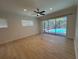 Bright, open living room with tile floors and a view of the outdoor pool area; perfect for entertaining and relaxation at 6839 Turnberry Isle Ct, Lakewood Ranch, FL 34202