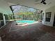 Relaxing enclosed pool with a brick patio and spa, perfect for entertaining at 6839 Turnberry Isle Ct, Lakewood Ranch, FL 34202