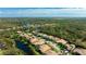 Beautiful community aerial view showcases the houses, ponds, and surrounding lush landscape at 7081 Grassland Ct, Sarasota, FL 34241