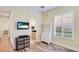 Bedroom featuring plantation shutters, wood floors, and ensuite bathroom at 7081 Grassland Ct, Sarasota, FL 34241