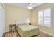 Cozy bedroom with a ceiling fan, plantation shutters, and closet at 7081 Grassland Ct, Sarasota, FL 34241