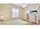 Bright bedroom with plantation shutters, wood floors and ensuite bathroom access at 7081 Grassland Ct, Sarasota, FL 34241