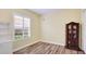 Bedroom featuring plantation shutters and wood floors at 7081 Grassland Ct, Sarasota, FL 34241