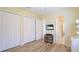 Bedroom with wood floors, a closet, and an ensuite bathroom at 7081 Grassland Ct, Sarasota, FL 34241