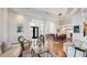 Open-concept living space with hardwood floors, an inviting seating arrangement, and an elegant entryway at 7081 Grassland Ct, Sarasota, FL 34241