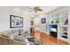 Open living room with comfortable seating, entertainment center, and a view of the outdoor area at 7081 Grassland Ct, Sarasota, FL 34241