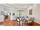 Bright living room with hardwood floors, white walls, and stylish furnishings, offering a comfortable and inviting space at 7081 Grassland Ct, Sarasota, FL 34241