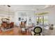 Spacious living area featuring hardwood floors, an open layout, and seamless access to the pool area at 7081 Grassland Ct, Sarasota, FL 34241