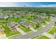 An aerial view of a well maintained single Gathering house, showing the landscaping and neighborhood at 7410 61 E St, Palmetto, FL 34221