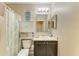 Charming bathroom featuring a dark wood vanity, neutral walls, and tropical-themed shower curtain at 7410 61 E St, Palmetto, FL 34221