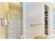 The bathroom has a tiled shower with a floral shower curtain and a storage cubby at 7410 61 E St, Palmetto, FL 34221