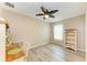 Simple bedroom boasts wood-look floors, natural light, and space for a desk at 7410 61 E St, Palmetto, FL 34221