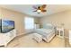 Nicely decorated bedroom with a ceiling fan, bright colors, and wood-look flooring at 7410 61 E St, Palmetto, FL 34221
