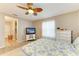 Bright bedroom features a ceiling fan, wood-look flooring, and walk-in closet at 7410 61 E St, Palmetto, FL 34221