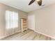Clean bedroom with wood-look floors offers a ceiling fan and closet space at 7410 61 E St, Palmetto, FL 34221