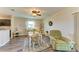 Dining room with a table set for four, a ceiling fan, and wood-look flooring at 7410 61 E St, Palmetto, FL 34221