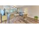 Bright and airy living room with ceiling fan, a plush sofa, and modern decor at 7410 61 E St, Palmetto, FL 34221
