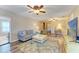 Cozy living room featuring a comfortable sofa, stylish area rug, and plenty of natural light at 7410 61 E St, Palmetto, FL 34221