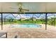 Relaxing screened-in pool area with comfortable seating and scenic backyard views at 7410 61 E St, Palmetto, FL 34221