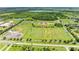 Aerial view highlighting multiple sports fields near community, offering ample space for recreation and local sports at 7410 61 E St, Palmetto, FL 34221