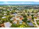 Aerial view showing the house location within the neighborhood, surrounded by lush trees and waterfront views at 7615 17Th W Ave, Bradenton, FL 34209