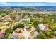 Picturesque aerial view of a residential neighborhood, featuring a pond and a mix of home styles near waterfront at 7615 17Th W Ave, Bradenton, FL 34209