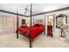 Cozy bedroom featuring a four-poster bed, warm lighting, and decor details enhancing the relaxing atmosphere at 7615 17Th W Ave, Bradenton, FL 34209