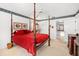 Relaxing bedroom with a four-poster bed, classic decor, and an ensuite bathroom for added convenience at 7615 17Th W Ave, Bradenton, FL 34209