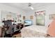 Bedroom with neutral walls, a comfortable bed, and desk space at 7615 17Th W Ave, Bradenton, FL 34209
