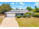 Charming single-story home featuring a well-maintained front yard, driveway, and attached garage at 7615 17Th W Ave, Bradenton, FL 34209