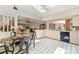 Well-lit kitchen area featuring an open concept with white-tiled floors and countertops, connecting to the living room at 7615 17Th W Ave, Bradenton, FL 34209
