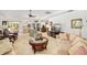 Open-concept living room with a view of the kitchen and comfortable seating arrangements at 7615 17Th W Ave, Bradenton, FL 34209