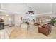 Spacious living room with neutral carpeting, comfortable seating, and a ceiling fan at 7615 17Th W Ave, Bradenton, FL 34209