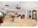 Comfortable living room featuring a plush sofa, armchairs, and a decorative cabinet at 7615 17Th W Ave, Bradenton, FL 34209