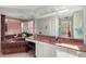 Main bathroom boasts a jetted tub, white cabinets, and a large vanity at 7615 17Th W Ave, Bradenton, FL 34209
