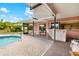 Enjoy the covered patio and bar near the private backyard pool at 7615 17Th W Ave, Bradenton, FL 34209