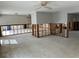 Open-concept living space with exposed studs and concrete floors offering a renovation opportunity at 782 Birdsong Ln, Sarasota, FL 34242