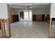Open living space with concrete floor, exposed framing, and sliding glass doors, ready for complete remodel at 782 Birdsong Ln, Sarasota, FL 34242