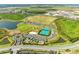 Aerial view showcasing the community's recreational amenities like tennis courts, playground, and sports fields at 8264 Summer Night Rd, Sarasota, FL 34241