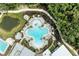 Overhead view of community pool with distinct clover design surrounded by lounge chairs at 8264 Summer Night Rd, Sarasota, FL 34241
