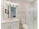 Well-lit bathroom with a glass enclosed shower, vanity with a modern sink, and a toilet at 8264 Summer Night Rd, Sarasota, FL 34241