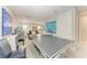 A spacious game room features a ping pong table and vintage arcade games at 8264 Summer Night Rd, Sarasota, FL 34241